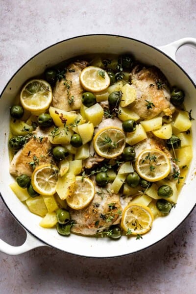 Mediterranean Lemon Chicken in a skillet from the top view.