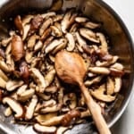 Sauteed shiitakes in a skillet from the top view.